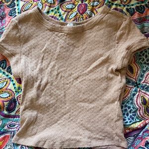 cropped light pink shirt